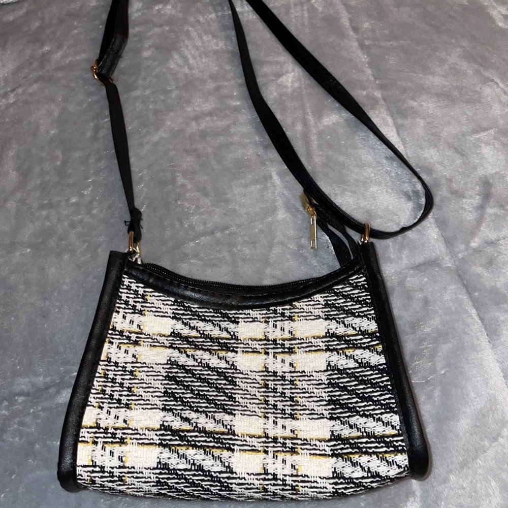 This is an adorable small purse but can hold so much !